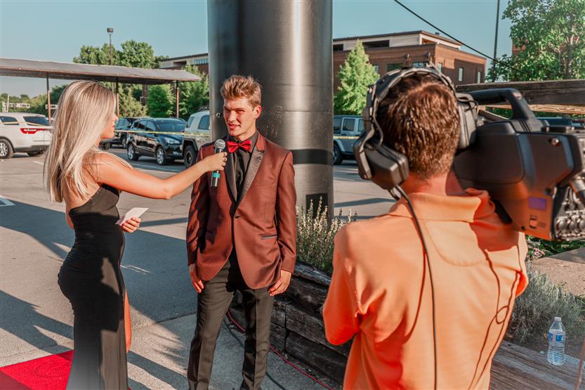 Student-athletes walk down the red carpet